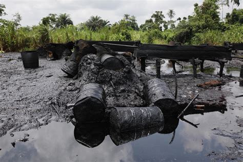 A blast at an illegal oil refinery site kills at least 15 in Nigeria, residents say
